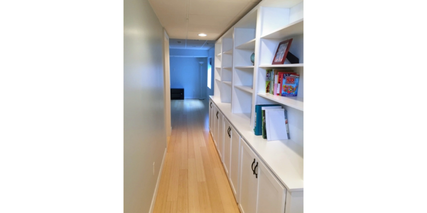 Hallway with large shelving unit