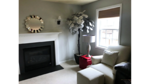 Furnished, carpeted living room with gas fireplace