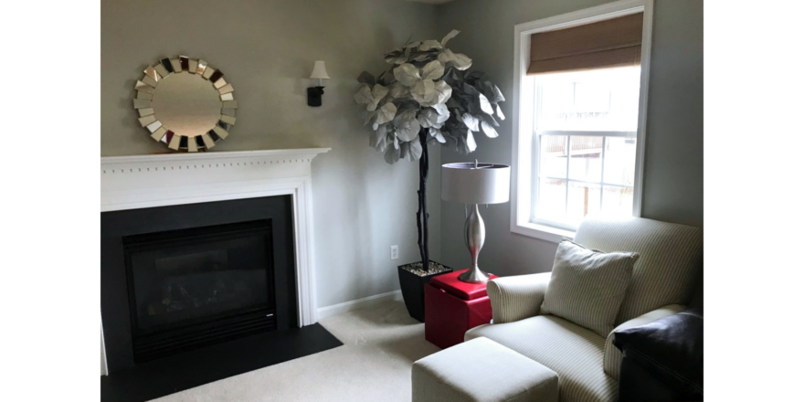 Furnished, carpeted living room with gas fireplace