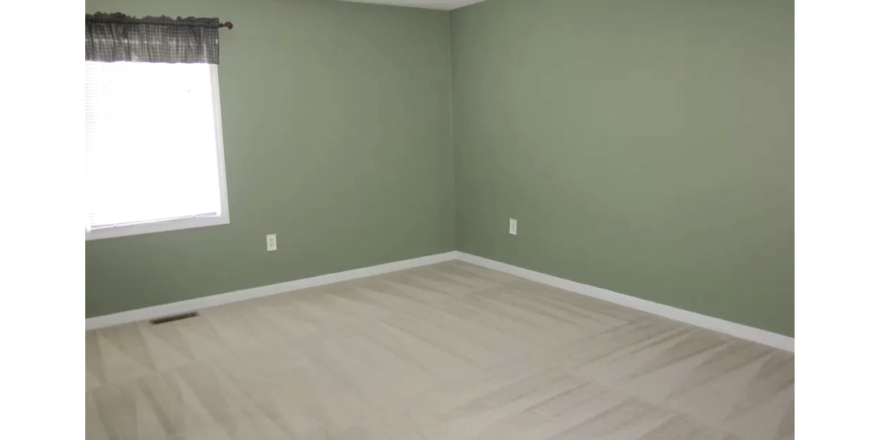 Unfurnished carpeted bedroom