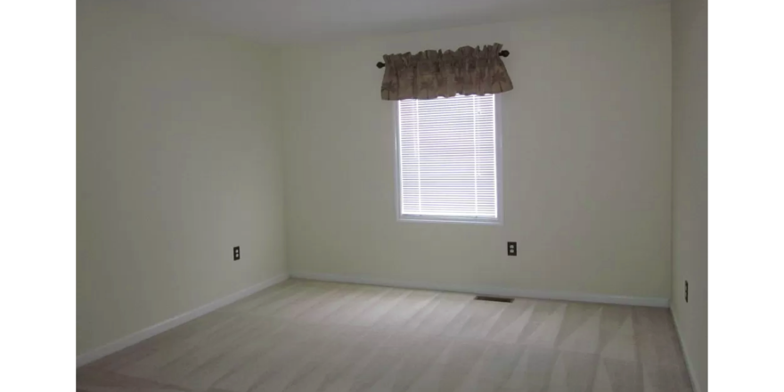 Unfurnished carpeted bedroom