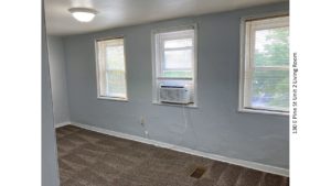 Unfurnished, carpeted living room