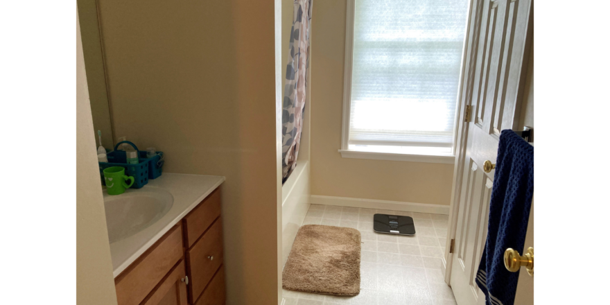 Bathroom with vanity and tub/shower combo