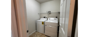 a laundry room with a washer and dryer