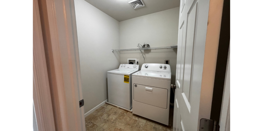 a laundry room with a washer and dryer