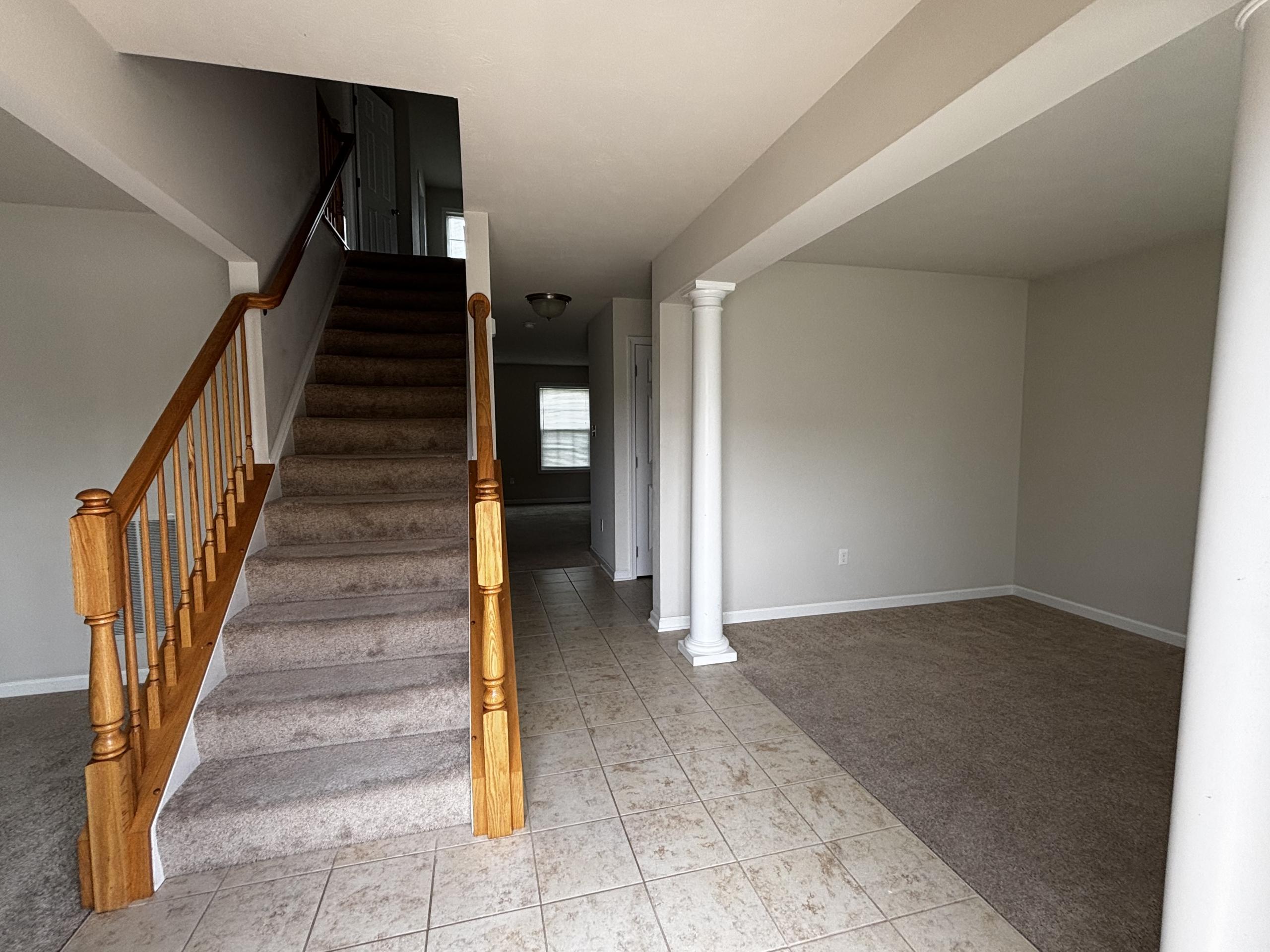 Staircase and entryway of empty house