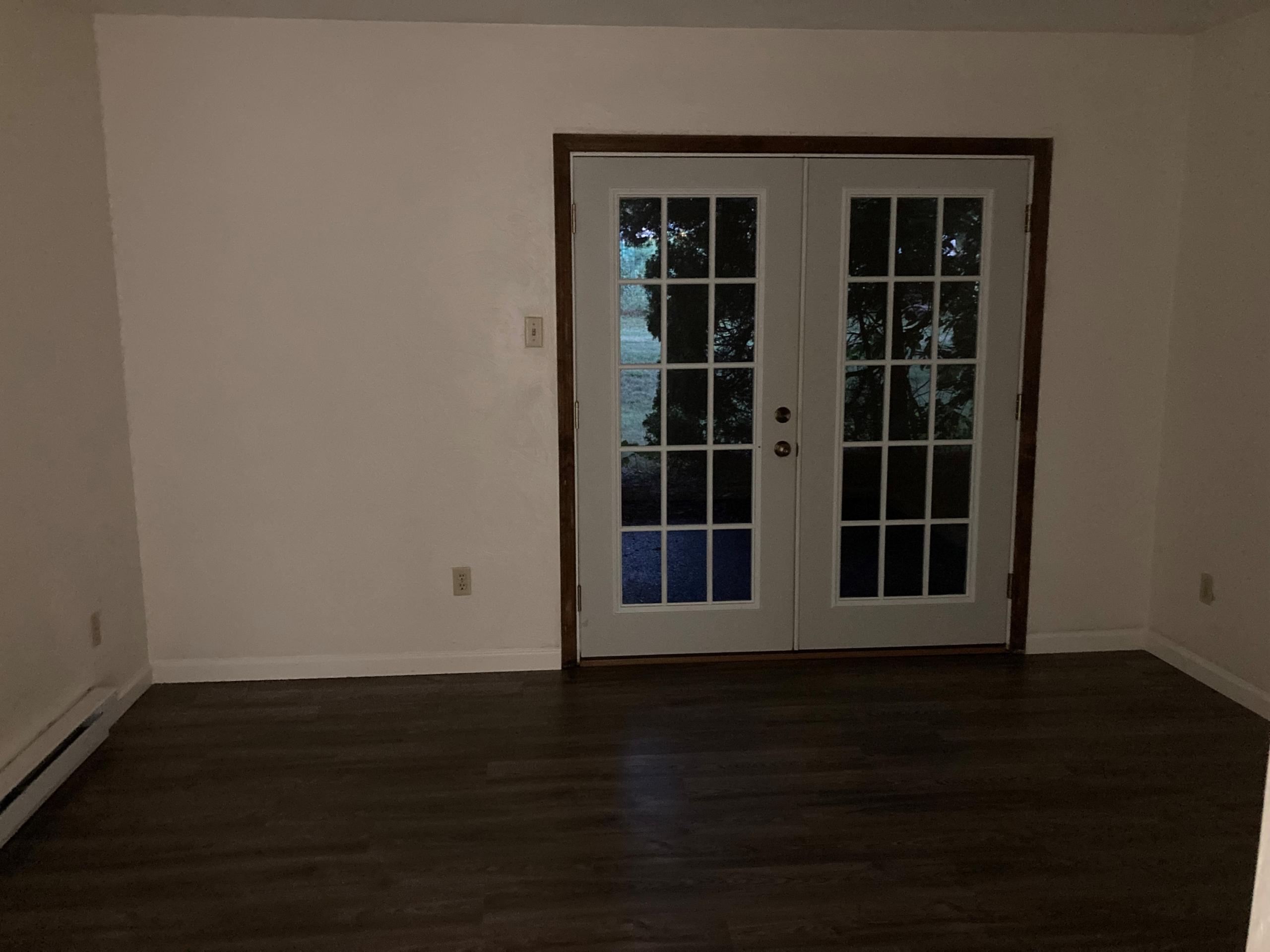 French doors in a white room.
