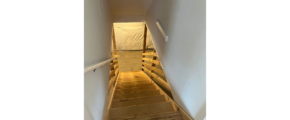 a staircase leading up to the top floor of a house