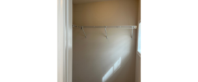 a bathroom with a shower and a light fixture