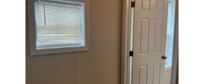 a white door and window in a room
