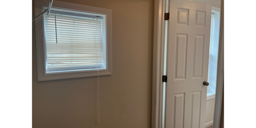 a white door and window in a room