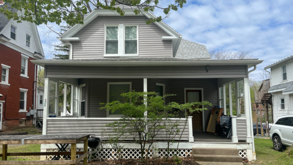 A house with gray siding and a porch