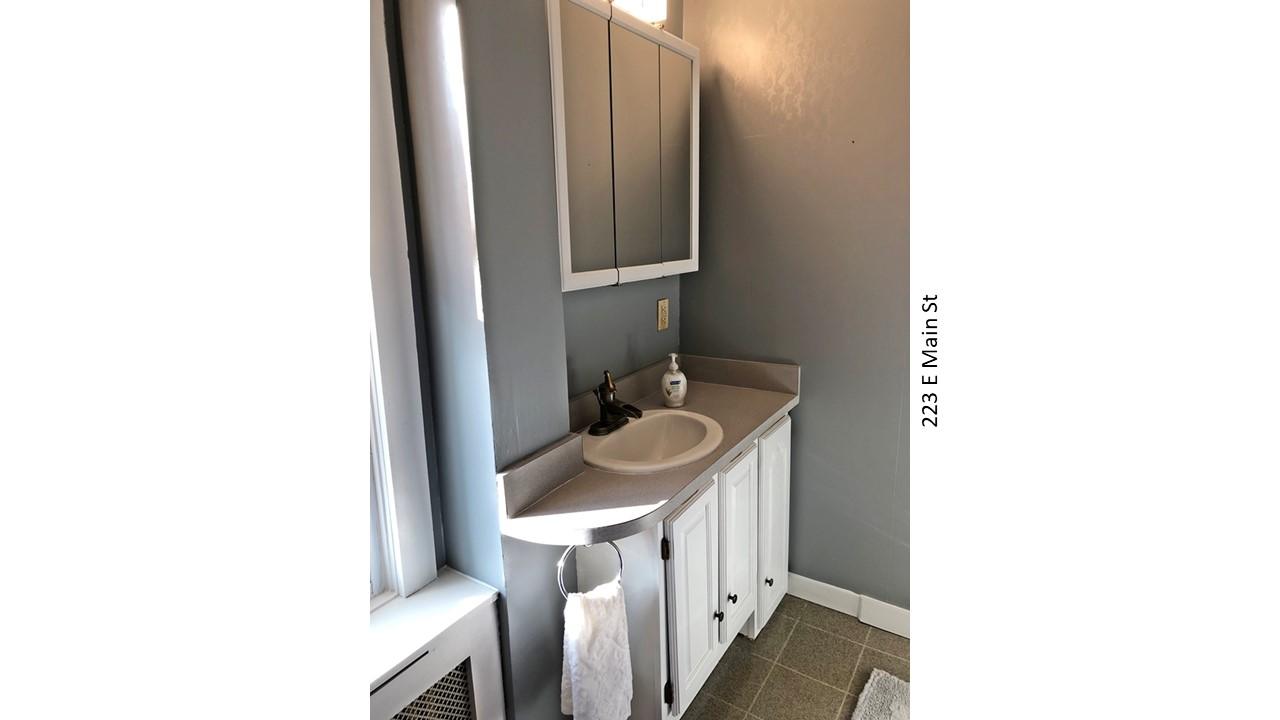 Bathroom vanity with white cabinets and sink