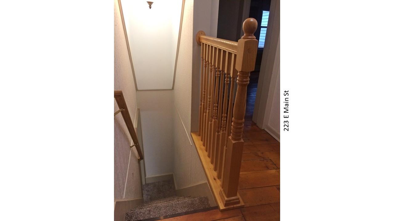 Wooden staircase with railing