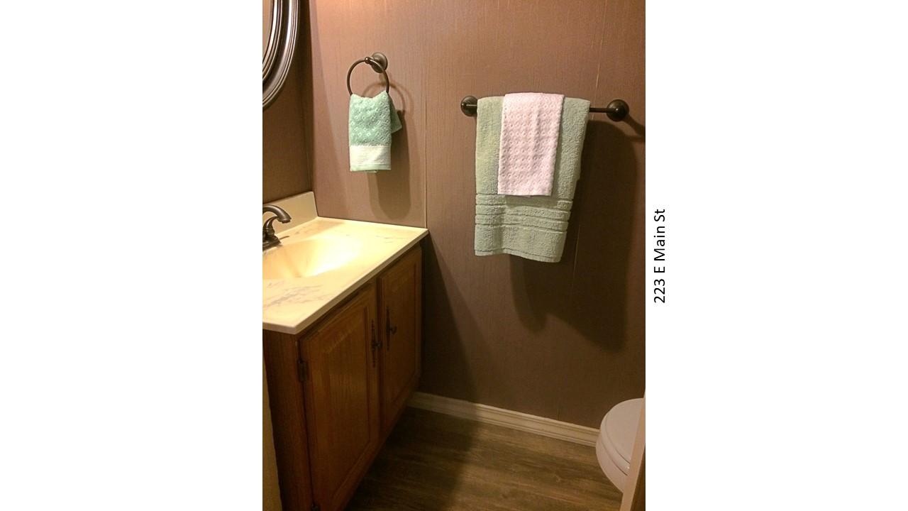 Powder room with vanity and towels