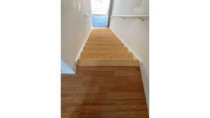 Wooden stairs from entry to main level