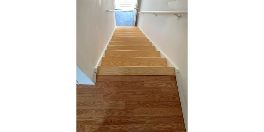 Wooden stairs from entry to main level