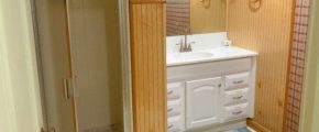 Bathroom with shower stall and vanity