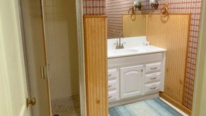 Bathroom with shower stall and vanity