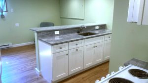 Kitchen counter with sink and cabinet space underneath