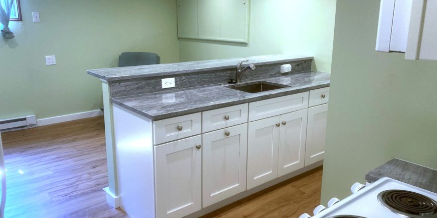 Kitchen counter with sink and cabinet space underneath