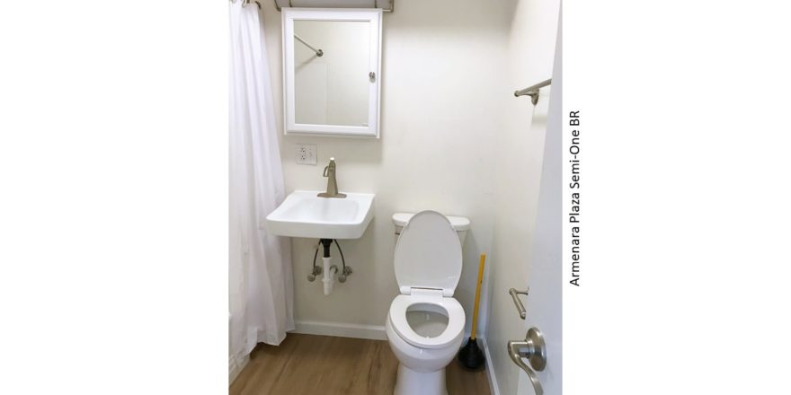 Bathroom with sink, medicine cabinet, and toilet