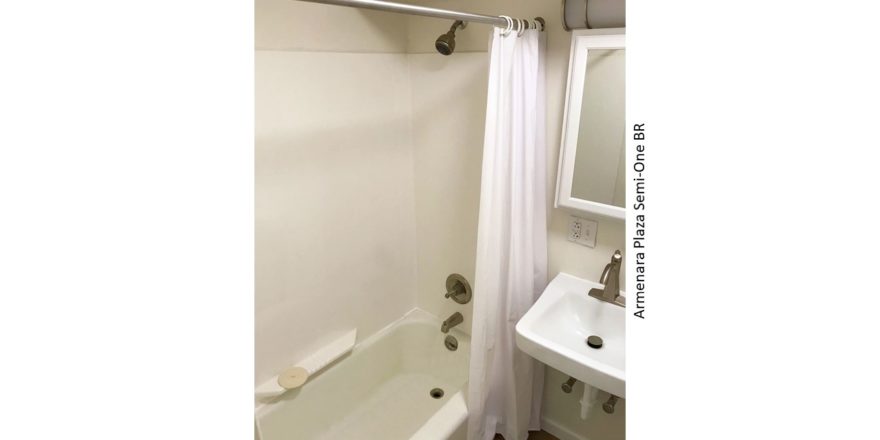 Bathroom with sink, medicine cabinet, and tub/shower combo