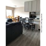 Kitchen and dining area with seating for 6 in dining area and counter with seating in kitchen