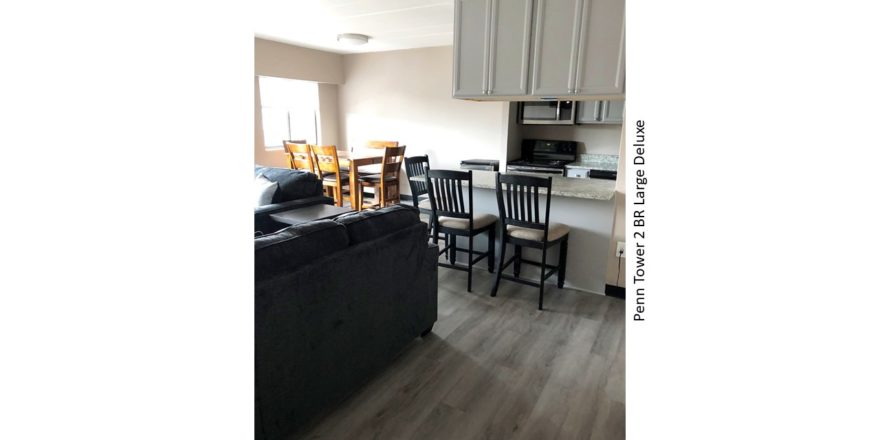 Kitchen and dining area with seating for 6 in dining area and counter with seating in kitchen