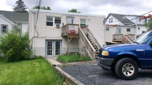 Gravel parking lot and patio