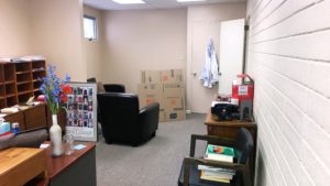 Waiting area with chairs and boxes