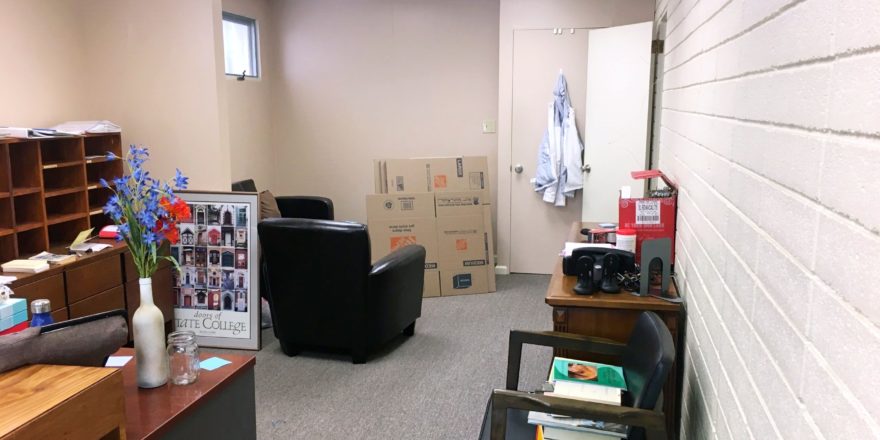 Waiting area with chairs and boxes