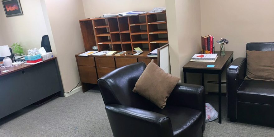 Waiting area with chairs and mailbox