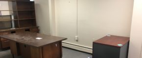 Office space with furniture and boxes