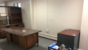 Office space with furniture and boxes