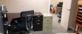 Office space with furniture and boxes