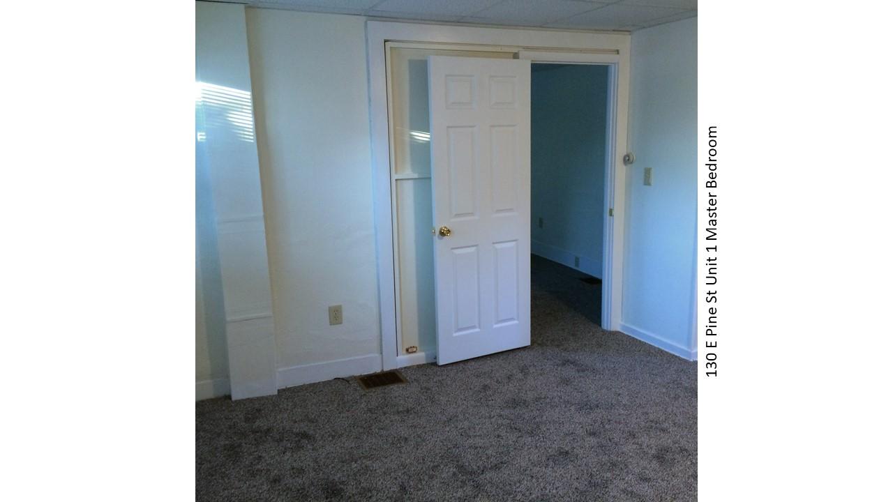 Master bedroom door open at 130 E Pine St