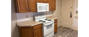 a kitchen with a white stove top oven
