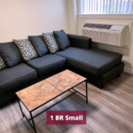 Living room with sectional couch, dining table, and coffee table