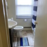 Bathroom with tub/shower combo, toilet, and vanity