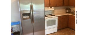 Kitchen with fridge and range oven