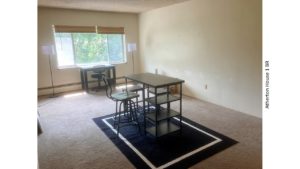 Living room with two desks and chairs