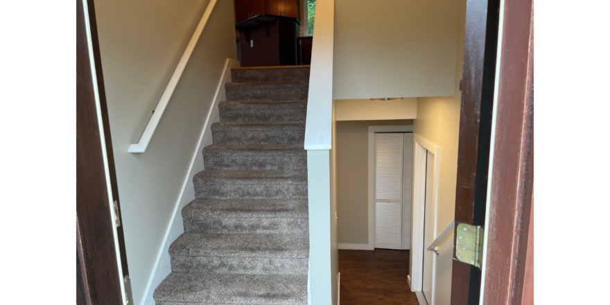 the stairs leading to the second floor of a house