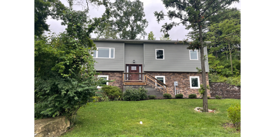 a house with a large yard in front of it
