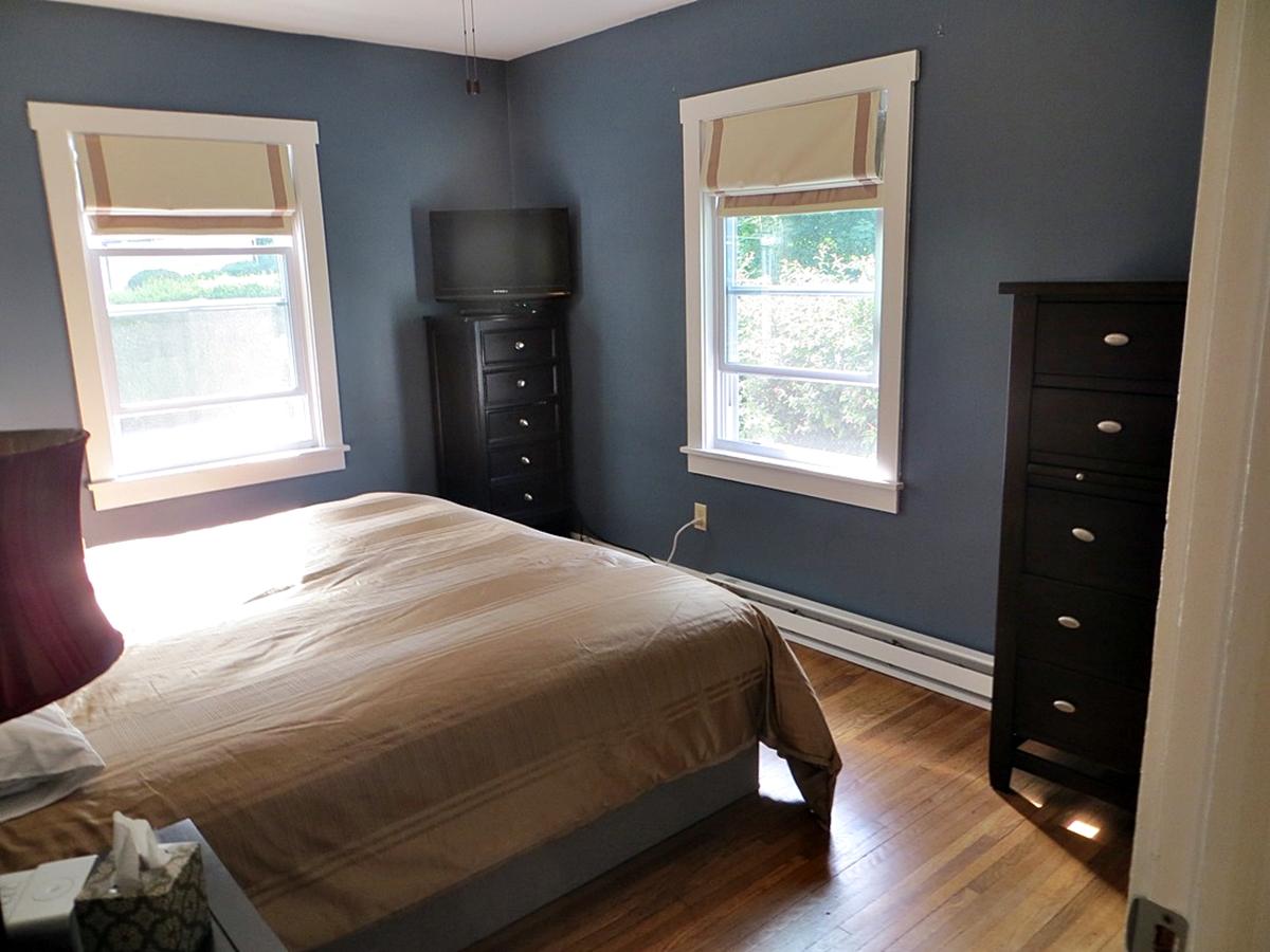 Bedroom with bed and dressers