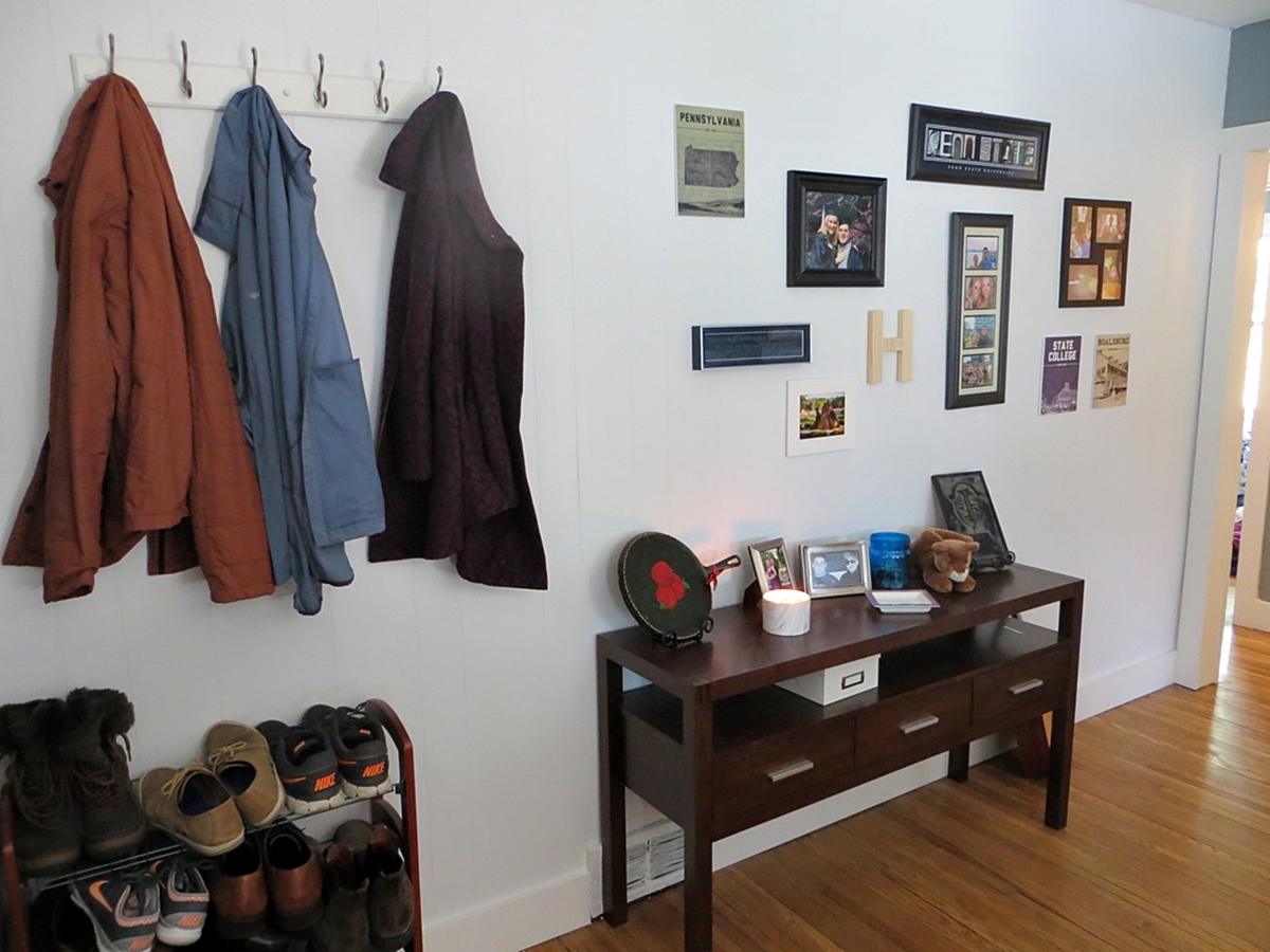 Entryway with coats, shoes, and decor