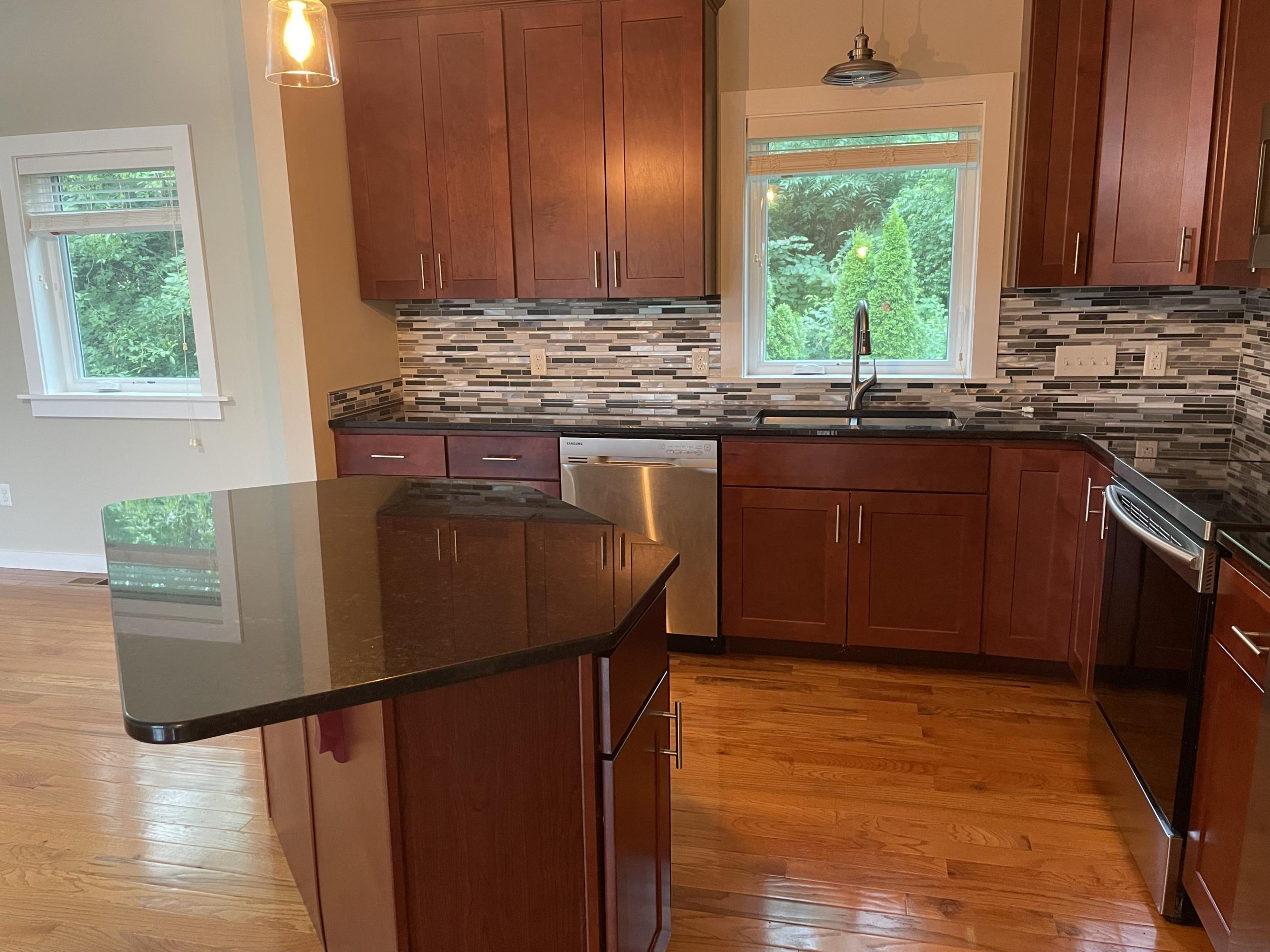 Modern kitchen with cherry cabinets and island