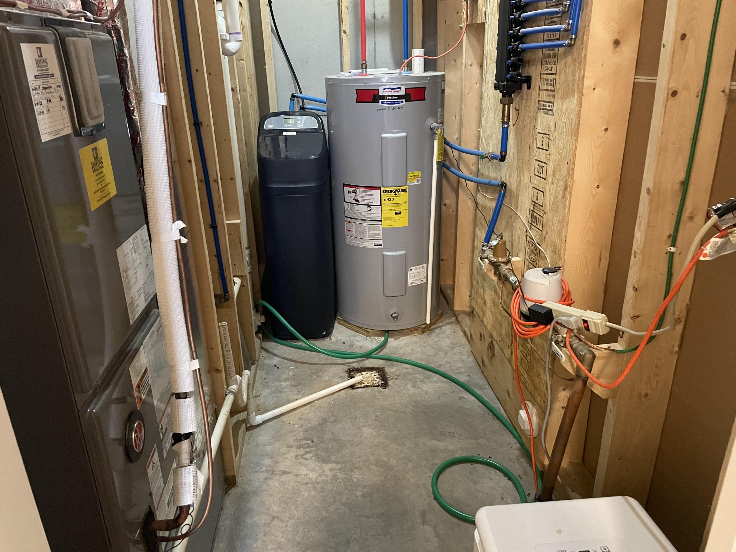 Home utility room with furnace, water heater