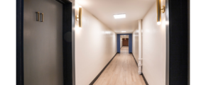 a long hallway with two lights on either side