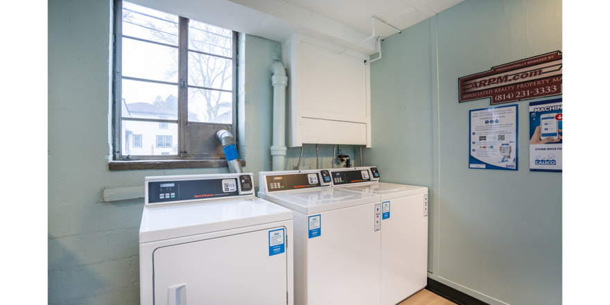 a washer and dryer in a small room